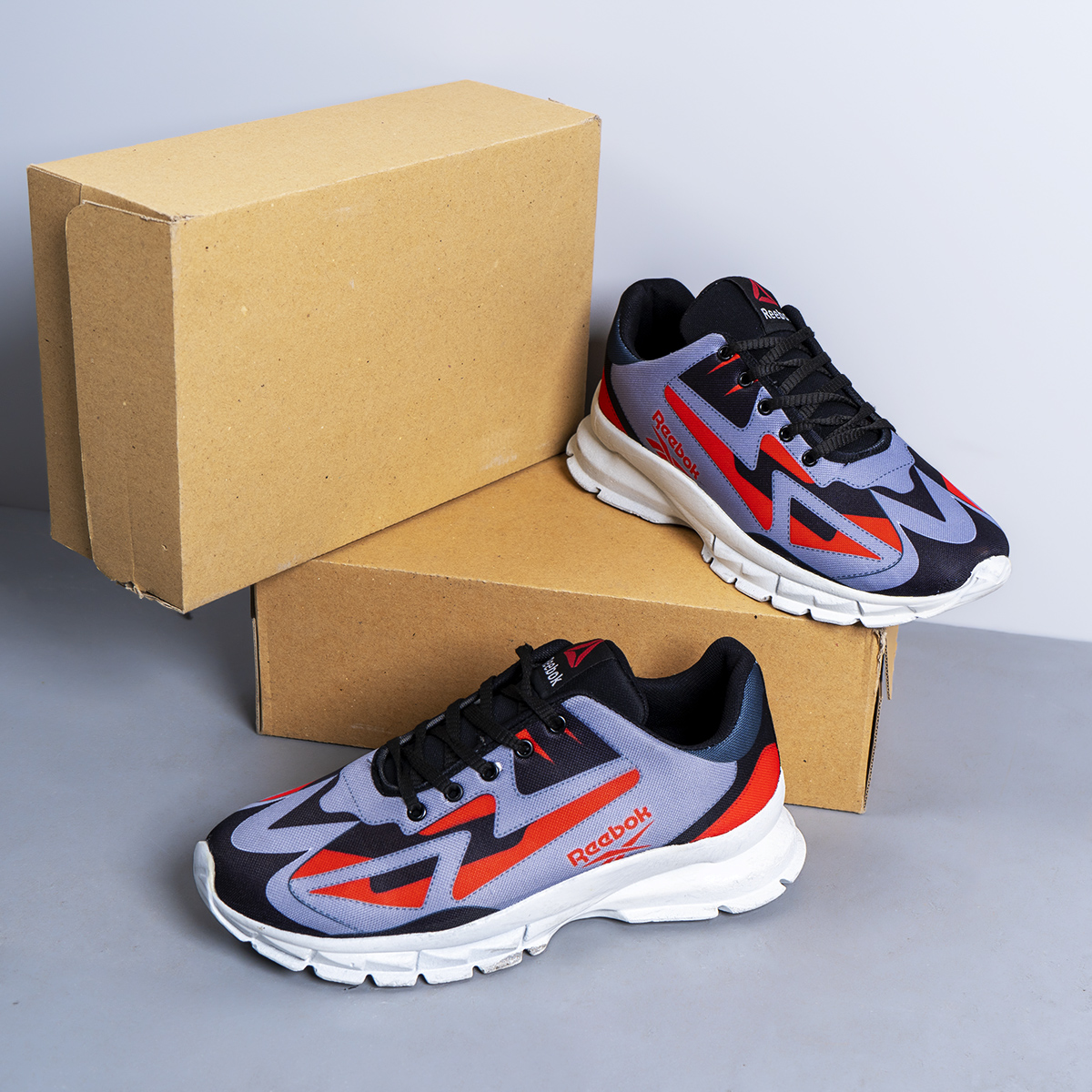 کفش ورزشی ریبوک طوسی قرمز مردانه مدل Ervan