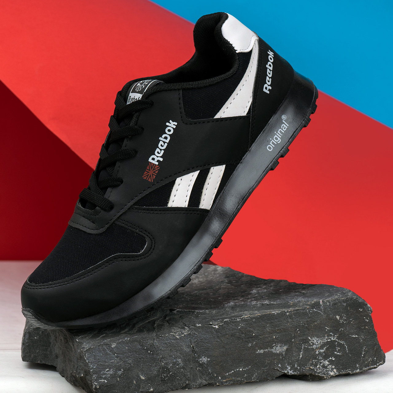 کفش ورزشی Reebok مشکی سفید مردانه مدلRako