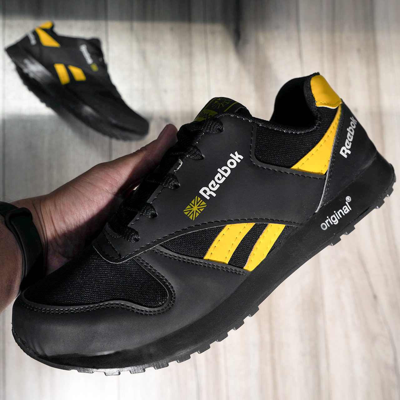 کفش ورزشی Reebok مشکی زرد مردانه مدلRako